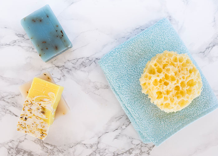 Natural Sea Sponge in the bathroom with soap from Freepik